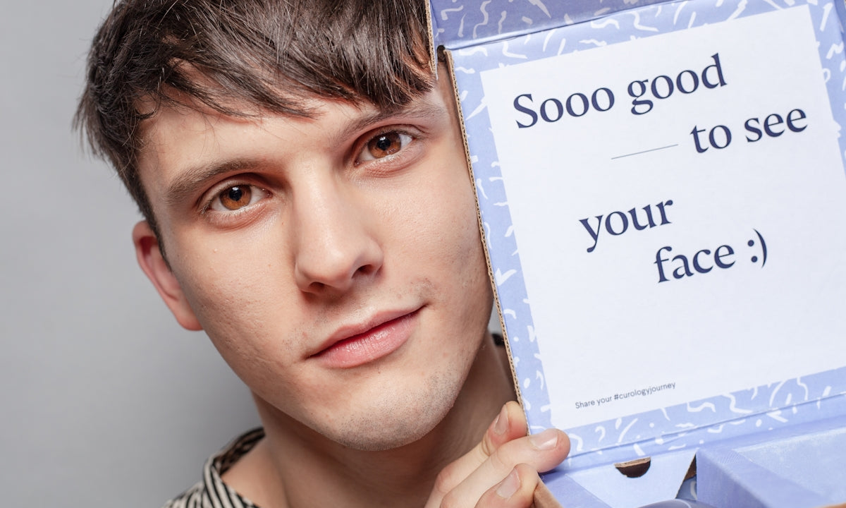 man holding purple and white so god to see your face box