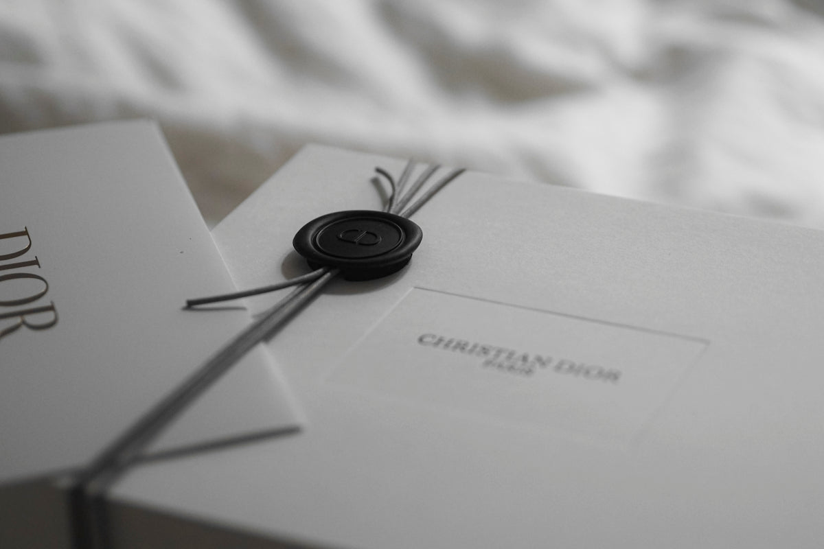 Dior gift box with wax seal and ribbon