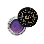 Cohorted The Electric Bloom Edit beauty box displayed on a cream pedestal, surrounded by purple and pink flowers in a botanical setting, beauty boxes, UK, Gift,  KVD Beauty, Dazzle Gel Hyper-Metallic Eyeshadow,VIOLET AURORA 20