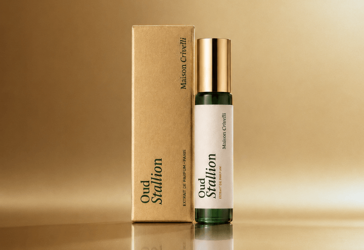 Maison Crivelli Oud Stallion perfume free gift with first subscription, bottle with a gold cap next to its gold cardboard box, set against a warm gold background.